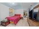 Bedroom with red patterned bedding, wood laminate flooring, and natural light coming through the window at 820 Nuttree Pl, Raleigh, NC 27606
