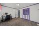 Bedroom featuring a work desk and chair, and purple trim at 820 Nuttree Pl, Raleigh, NC 27606