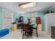 Dining area with a round table, chairs, and natural light from multiple windows at 820 Nuttree Pl, Raleigh, NC 27606