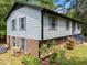 Two-story home with brick foundation, light blue siding, and well-maintained landscaping at 820 Nuttree Pl, Raleigh, NC 27606