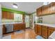 Kitchen featuring wood cabinets, stainless steel dishwasher, and eat-in area at 820 Nuttree Pl, Raleigh, NC 27606