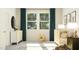 Bright Bedroom featuring a wooden crib, cute animal prints, and a rocking horse for a playful atmosphere at 832 Emerald Bay Cir, Raleigh, NC 27610