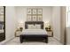 Cozy bedroom with botanical art, soft lighting, and comfortable furnishings at 832 Emerald Bay Cir, Raleigh, NC 27610