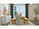 Modern dining room with wooden table and chairs, bright window and decorative accents at 832 Emerald Bay Cir, Raleigh, NC 27610