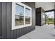 Close-up showcasing the home's exterior with clean lines, modern windows, and a well-kept concrete walkway at 8629 Dukes Lake Rd, Zebulon, NC 27597