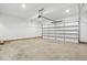 Spacious garage with concrete flooring and an automatic door opener installed at 8629 Dukes Lake Rd, Zebulon, NC 27597