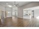 Spacious living room boasts an open concept, hardwood floors, modern lighting, and stylish doors at 8629 Dukes Lake Rd, Zebulon, NC 27597
