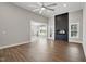 Living area featuring hardwood floors, fireplace, and open design leading to the kitchen and dining area at 8629 Dukes Lake Rd, Zebulon, NC 27597