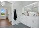 Stylish main bathroom features double vanity with sleek fixtures, and walk-in closet at 8629 Dukes Lake Rd, Zebulon, NC 27597
