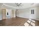 Spacious main bedroom boasts tray ceilings, neutral walls, and natural light from large windows at 8629 Dukes Lake Rd, Zebulon, NC 27597