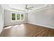 Bright main bedroom boasts tray ceilings, neutral walls, and natural light from large windows at 8629 Dukes Lake Rd, Zebulon, NC 27597
