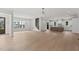 Bright open-concept living area features hardwood floors and seamless integration with the kitchen at 9305 Field Maple Ct, Raleigh, NC 27613
