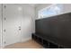 Bright mudroom featuring a built-in bench, storage cubbies, coat hooks, and a view of the outdoors at 9305 Field Maple Ct, Raleigh, NC 27613