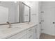 Bright bathroom with double sink vanity, white marble countertop and bronze fixtures at 9309 Field Maple Ct, Raleigh, NC 27613