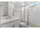 Bright bathroom featuring a large vanity, subway tile, and a glass shower at 9309 Field Maple Ct, Raleigh, NC 27613