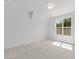 Bright bedroom featuring neutral carpet and a large picture window at 9309 Field Maple Ct, Raleigh, NC 27613