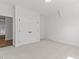 Neutral bedroom with a large closet featuring double doors for ample storage space at 9309 Field Maple Ct, Raleigh, NC 27613