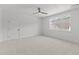Bedroom with neutral carpet, ceiling fan, and a window at 9309 Field Maple Ct, Raleigh, NC 27613
