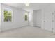 Bedroom with two windows and neutral carpet at 9309 Field Maple Ct, Raleigh, NC 27613