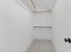 A walk-in closet featuring neutral carpet and hanging rods for storage at 9309 Field Maple Ct, Raleigh, NC 27613