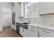 Gourmet kitchen featuring stainless steel appliances, farmhouse sink and custom backsplash at 9309 Field Maple Ct, Raleigh, NC 27613