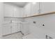 Laundry room featuring ample cabinet space and counter top at 9309 Field Maple Ct, Raleigh, NC 27613