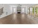 Spacious living room features hardwood floors, fireplace, ceiling fan, and sliding glass doors to porch at 9309 Field Maple Ct, Raleigh, NC 27613