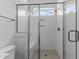 Modern bathroom with a frameless glass shower enclosure and subway tile at 9309 Field Maple Ct, Raleigh, NC 27613
