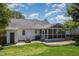 Large backyard with a patio, fire pit, and screened-in porch at 9404 Dawnshire Rd, Raleigh, NC 27615