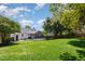 Expansive backyard with a patio, fire pit, and screened-in porch, perfect for outdoor activities at 9404 Dawnshire Rd, Raleigh, NC 27615