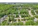 Scenic aerial view of a home surrounded by lush greenery, offering a tranquil and private setting in a desirable neighborhood at 104 Montauk Point Pl, Cary, NC 27513