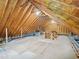 Large attic space with exposed rafters, ductwork, and flooring, presenting an opportunity for customizable storage at 104 Montauk Point Pl, Cary, NC 27513