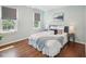 Charming bedroom with hardwood floors and serene natural light at 104 Montauk Point Pl, Cary, NC 27513