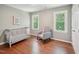 Cozy Bedroom with a crib, rocking chair, hardwood floors and natural light at 104 Montauk Point Pl, Cary, NC 27513