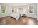 Bright bedroom with hardwood floors, natural light, and neutral decor at 104 Montauk Point Pl, Cary, NC 27513