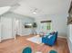 Bright bonus room with hardwood floors, ceiling fan, and TV at 104 Montauk Point Pl, Cary, NC 27513
