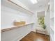 Walk-in closet offering custom built-ins and great natural light from the window at 104 Montauk Point Pl, Cary, NC 27513