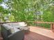 Outdoor deck with outdoor furniture, perfect for entertaining or relaxing among mature trees at 104 Montauk Point Pl, Cary, NC 27513