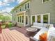 Inviting deck with a cushioned seating area and a decorative accent table, perfect for outdoor relaxation and entertaining at 104 Montauk Point Pl, Cary, NC 27513