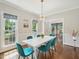 Bright dining room with ample natural light, stylish decor, and beautiful hardwood floors at 104 Montauk Point Pl, Cary, NC 27513