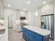 Newly remodeled kitchen featuring stainless steel appliances and blue island at 104 Montauk Point Pl, Cary, NC 27513