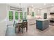 Bright kitchen and dining area with stainless steel appliances and natural light at 104 Montauk Point Pl, Cary, NC 27513