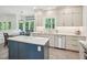 Eat-in kitchen featuring stainless appliances and large windows for natural light at 104 Montauk Point Pl, Cary, NC 27513