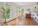 Sunlit living room featuring large windows, hardwood floors, and stylish furniture at 104 Montauk Point Pl, Cary, NC 27513