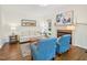 Comfortable living room with hardwood floors, fireplace, and a light-colored couch at 104 Montauk Point Pl, Cary, NC 27513