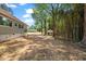 Expansive backyard with mature trees and shrubs for added privacy at 106 Circle Dr, Mebane, NC 27302
