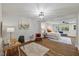 Open bedroom with sitting area and view of bed at 106 Circle Dr, Mebane, NC 27302