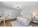 A spacious bedroom featuring bright lights, a desk, and a calm, relaxing vibe at 106 Circle Dr, Mebane, NC 27302