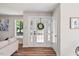 Bright entryway with decorative glass door and wood-look floors at 106 Circle Dr, Mebane, NC 27302