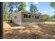 Well-maintained, single-story home with a welcoming porch and well-manicured lawn and trees at 106 Circle Dr, Mebane, NC 27302
